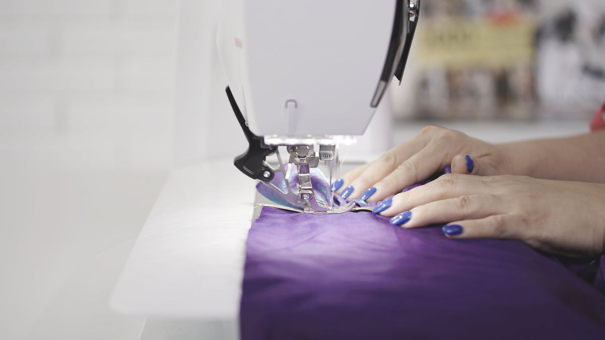 BERNINA 590 - front needle-area view sewing purple fabric
