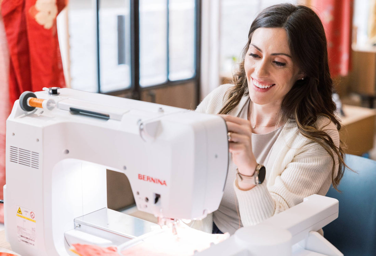BERNINA 770 QE PRO rear three-quarter view while sewing with slide-on table