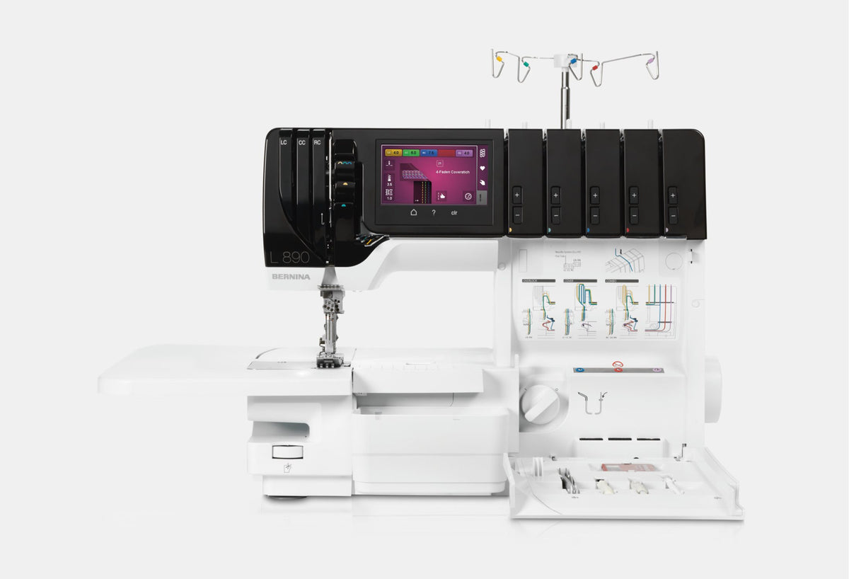 BERNINA L890 Overlock/Coverstitch Machine front view with looper cover open and threading paths visible