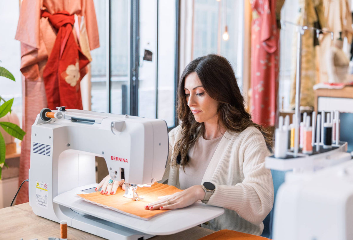 BERNINA 770 QE PRO sewing studio setup with slide-on table