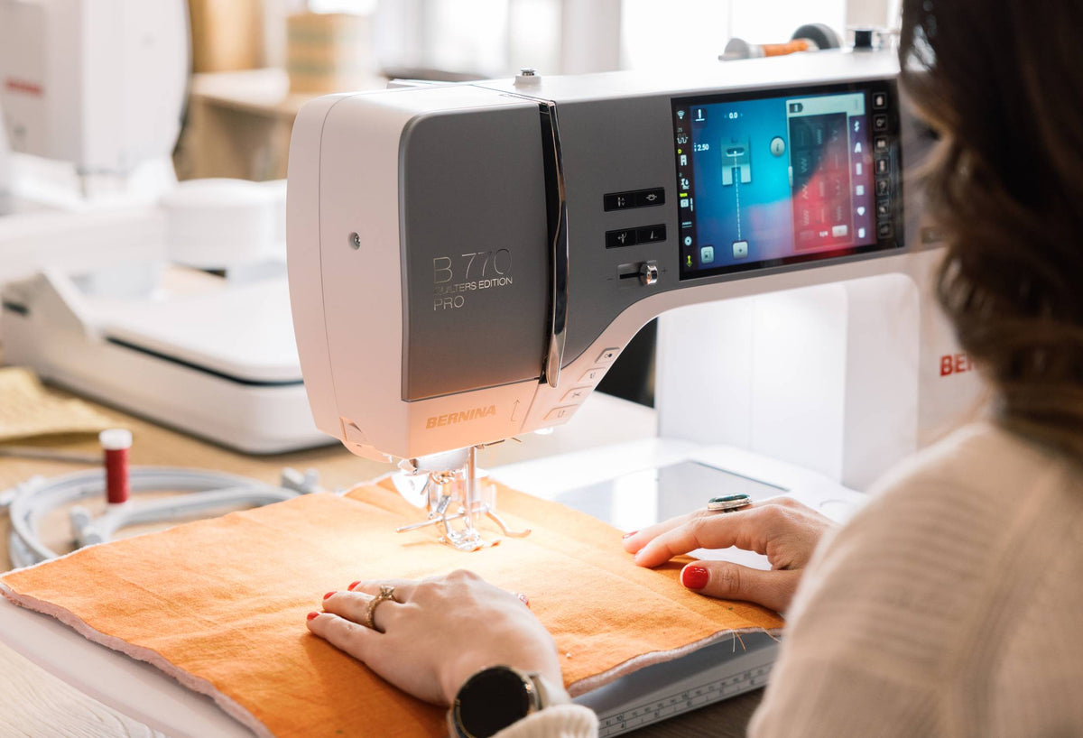 BERNINA 770 QE PRO close-up of touchscreen and needle area while sewing
