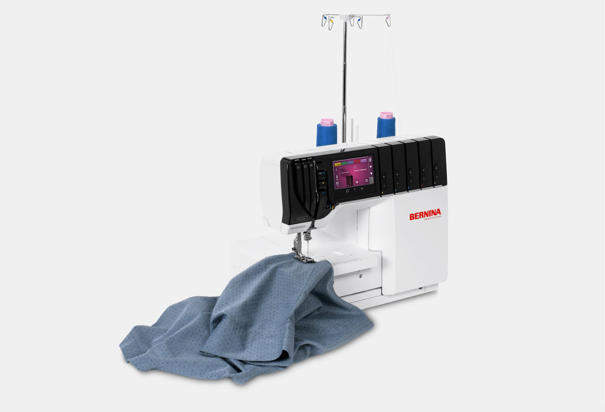 BERNINA L890 Overlock/Coverstitch Machine overlocker viewed from above with fabric at the needle