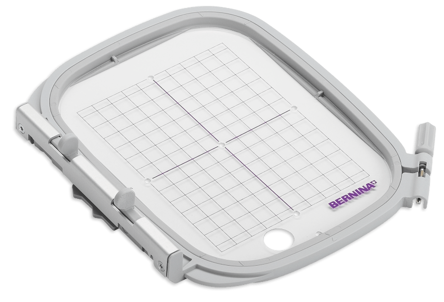 BERNINA Medium Embroidery Hoop, 100 × 130 mm, shown with positioning template in the official manufacturer product photo