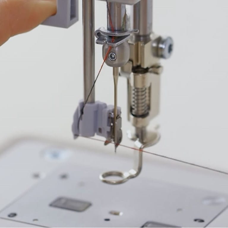 Representative BERNINA Q Series needle-threading and quilting-foot detail